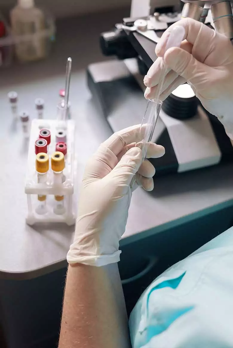 Functional-You-Dr-Seat-Lab-Tests Gloved hands holding test tube